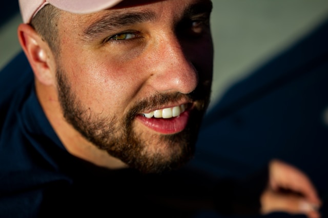 Close-up of man smiling faintly while living with dysthymia