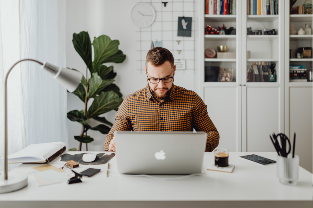 Man at desk with work stress burnout